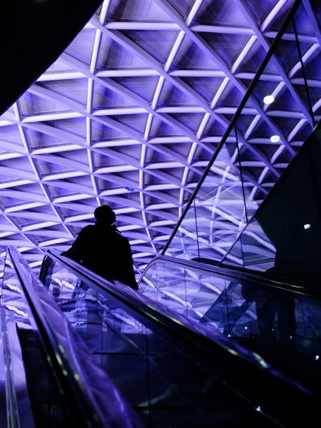 Silhouette of a man standing on an elevator at Kings Cross Station captured by Oh Brother Creative offering Video Production London