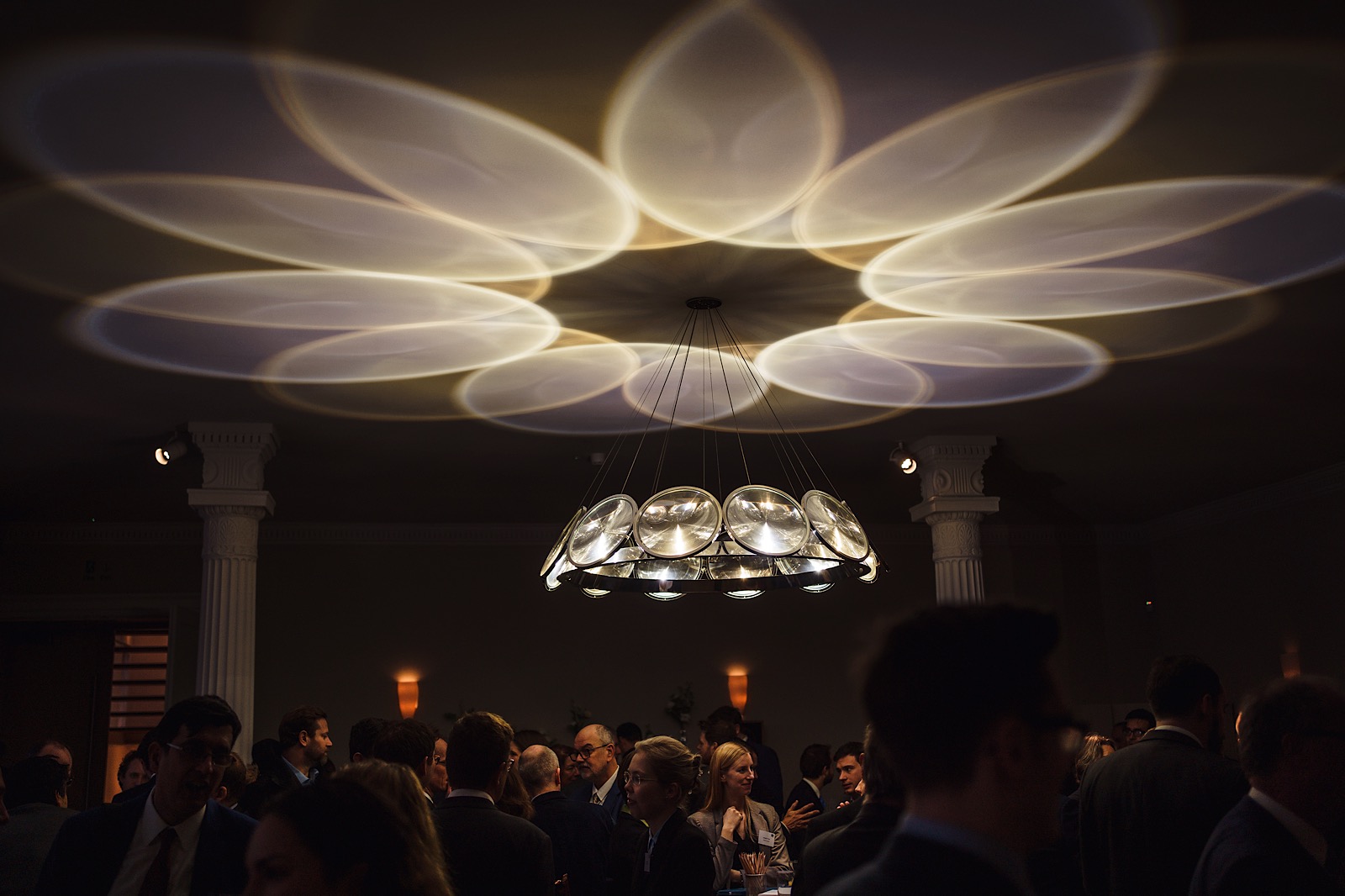 Effect on ceiling caused by lighting as people below blissfully unaware